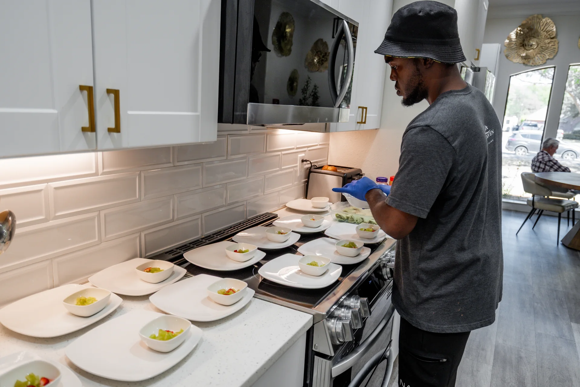A caregiver preparing a meal in a Brythaven community kitchen