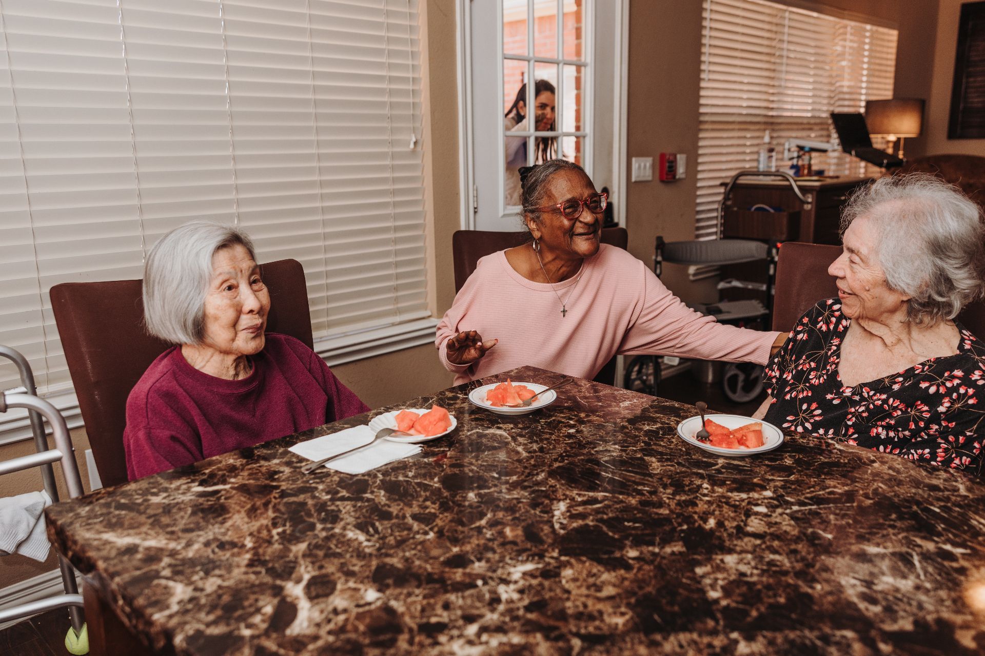 Residents sharing a meal in the dining area