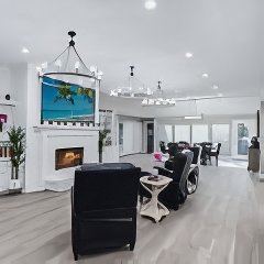 Living room with fireplace and lounge chairs at Willow Creek