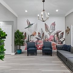 Residents in the mural lounge at Willow Creek